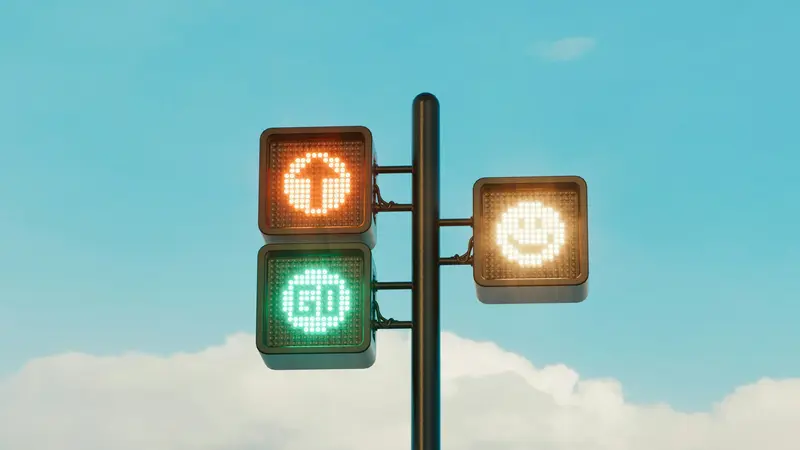 Ein klarer Weg nach vorn – der Happy Path als Orientierung Moderne Ampelinstallation mit Pfeil-, Go- und Smiley-Symbolen vor blauem Himmel, die einen klaren, reibungslosen Weg symbolisieren.