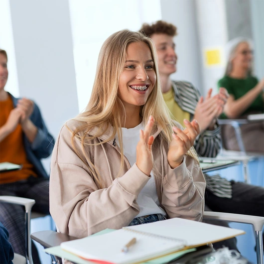 Smiling female student in classroom