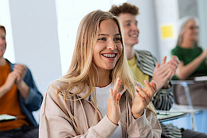 Smiling female student in classroom