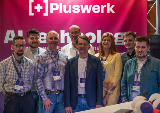The +Pluswerk team at the booth at Pimcore Inspire 2024